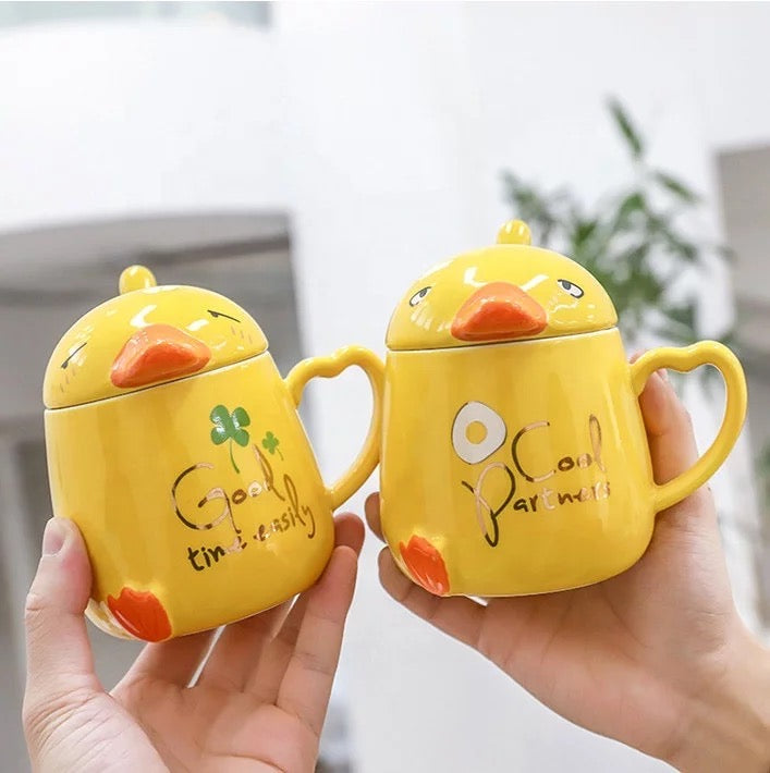 Collection of duck mugs with lid and spoon